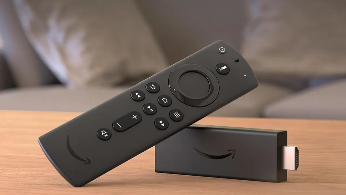Generic budget Android TV box compared with a Firestick, showing the size and build difference between no-name $40 boxes and Amazon's hardware